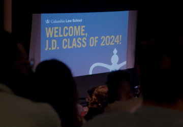 An audience facing a slide that reads: Welcome, J.D. Class of 2024!