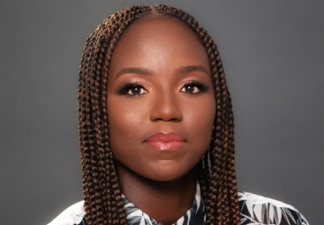 Woman with dark braids and red lipstick