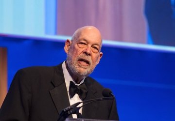 Michael J. Graetz speaking at a podium