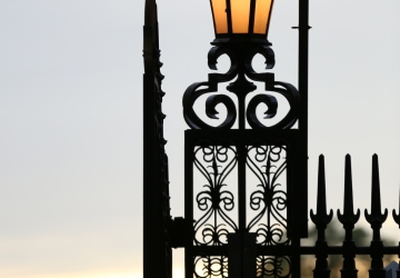 A lamp post with the Columbia crown on at the gates of campus