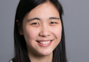 Smiling woman with long black hair