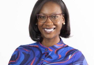 Woman in glasses and colorful blouse