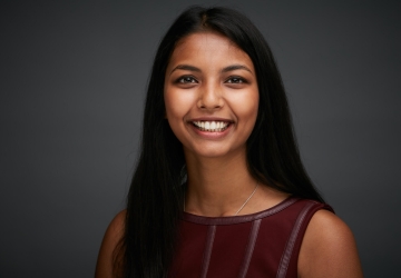 Smiling woman with long black hair