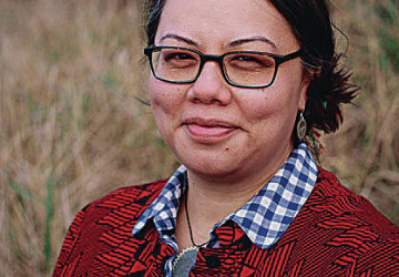 Dark haired woman in red cardigan 