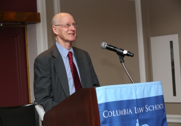 Man standing behind a podium