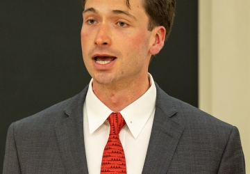 Conor Regan speaking at HFS Moot Court semi-finals