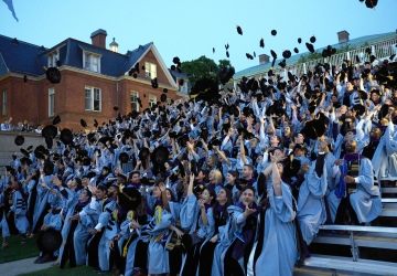 Columbia Law graduates toss their velvet tams in the air