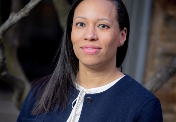 Woman in a blue jacket and white shirt