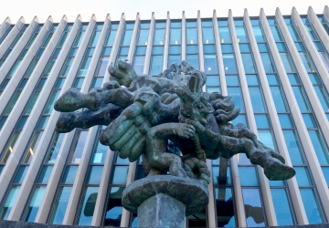 A view from below of the statue of Pegasus in front of Jerome Greene Hall