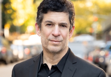 Columbia Law Professor Michael Heller in dark shirt and blazer