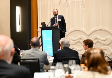Professor Jeremy Kessler at a podium