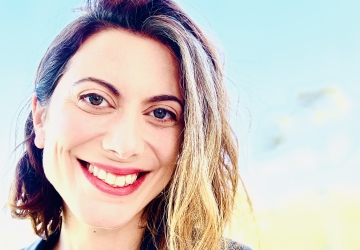 Erica Finkle headshot with pale blue background