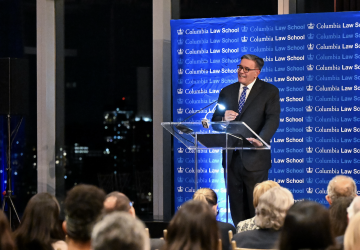 A man stands at a podium