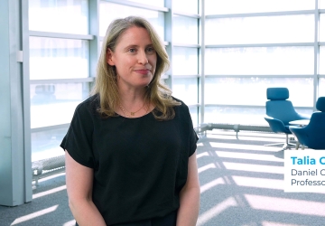 Professor Talia Gillis wearing a black shirt.