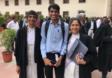 Menaka Guruswamy, Kumar Vardhman (petitioner), and Arundhati Katju ’17 LL.M. before oral arguments in July.