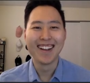Justin Yun in front of his computer at home