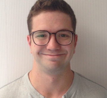 Columbia Law School graduate Michael J. Altman Lupu ’20 in glasses and T-shirt