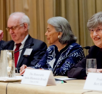Panelists sit at a table at the 2013 Reunion panel "Judging Without Trials"