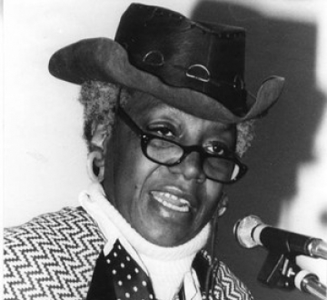 Flo Kennedy speaking at a mic. Credit: Schlesinger Library, Radcliffe Institute, Harvard University