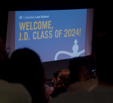 An audience facing a slide that reads: Welcome, J.D. Class of 2024!