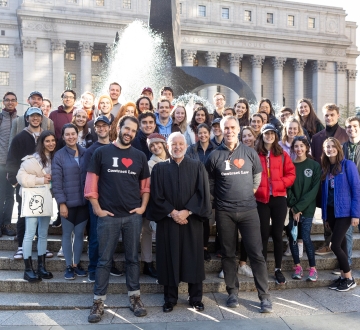 Students in the Contracts classes of Professor Eric Talley and Visiting Professor Julian Arato pose for a photo with Judge Jed Rakoff in front of the Thurgood Marshall United States Courthouse.