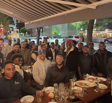 Law students of the Black Mens Initiative gather at a restaurant