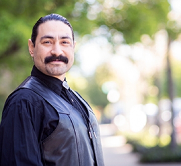 Man in a black shirt and black vest