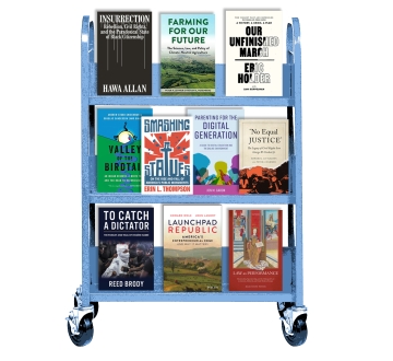 A blue library cart on which are displayed 10 books written by Law School alumni