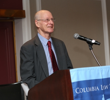 Man standing behind a podium