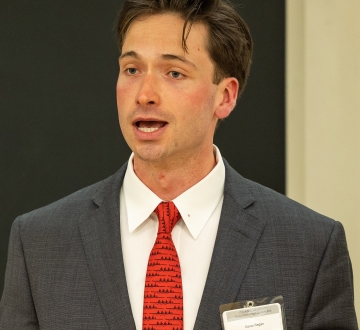 Conor Regan speaking at HFS Moot Court semi-finals