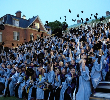 Columbia Law graduates toss their velvet tams in the air