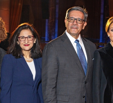Three women and one man in business attire