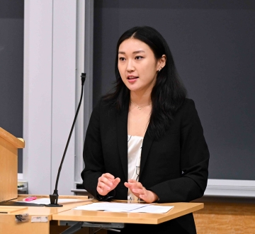 Alice Park stands behind a podium.