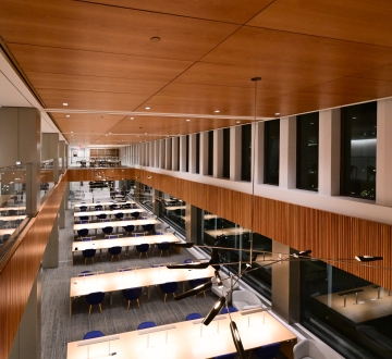 overhead photo of a large room with windows and long tables
