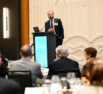 Professor Jeremy Kessler at a podium