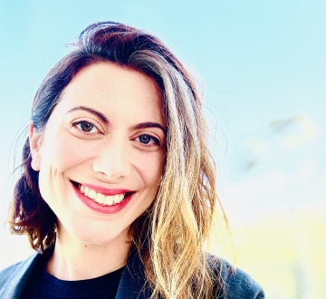 Erica Finkle headshot with pale blue background