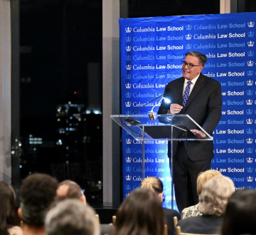 A man stands at a podium