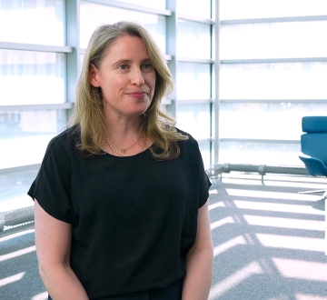 Professor Talia Gillis wearing a black shirt.