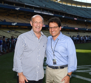 Stan Kasten and Mark Attanasio stand in Dodger Stadium.