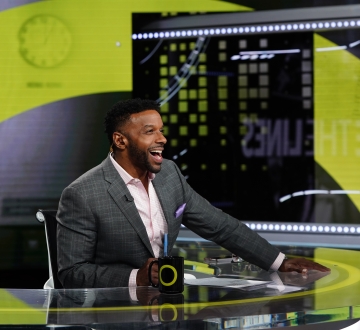 Ryan Smith behind the anchor desk of "Outside the Lines" on ESPN.