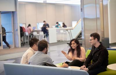 Students on the sofas in the Jerome Greene Lobby