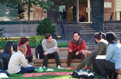 Professor Bert Huang meets with students on Revson Plaza