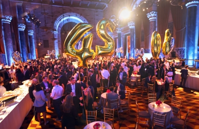 Crowd of people at indoor party at Columbia Law Reunion