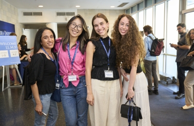 Four women students smiling