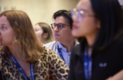Three students listening to orientation