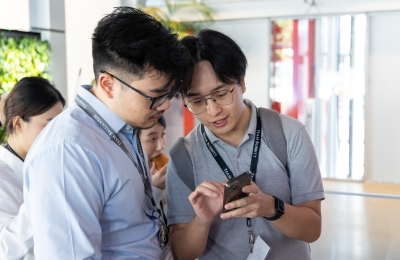 Two male students conferring at orientation 