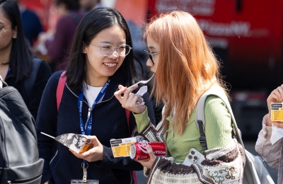 Two students eating and chatting