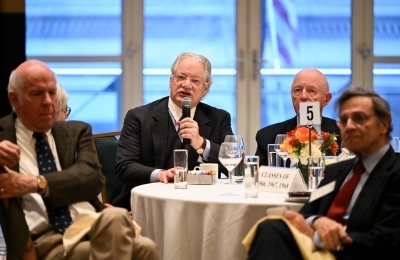 Men in suits at round table 
