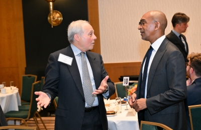 Man gesturing in conversation with second man