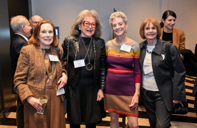 Lineup of women in professional attire with nametags